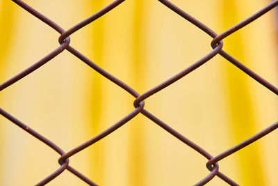 Close-up a steel fence which have rust to safety zone