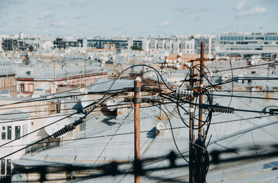 Electricity cables against buildings in city