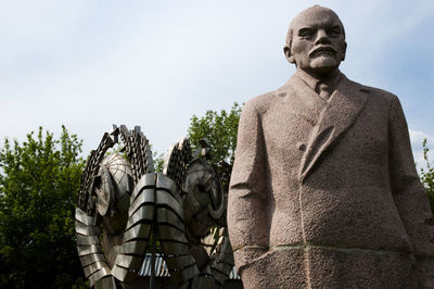 Low angle view of statue against sky