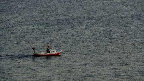 High angle view of men sailing on sea