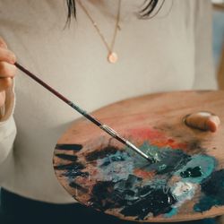 Close-up of hand holding ice cream