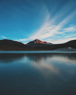 Sea with mountain in background