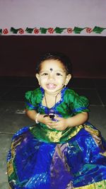 Portrait of smiling girl sitting