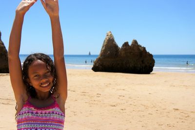 Woman standing on beach