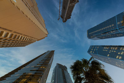 Low angle view of modern buildings against sky