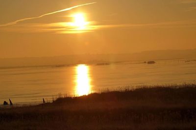 Scenic view of sea against sky during sunset