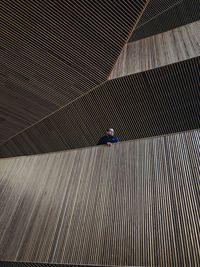 High angle view of person walking on staircase