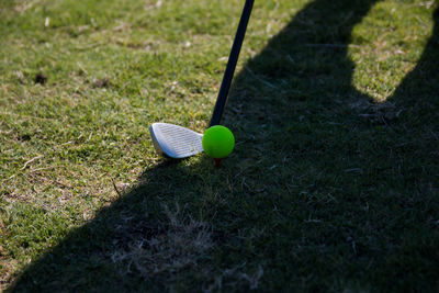 Green ball on golf field