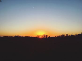 Scenic view of silhouette landscape against clear sky during sunset