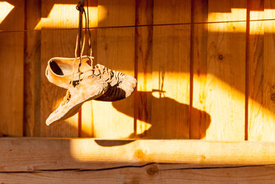 Close-up of horse hanging on wooden floor