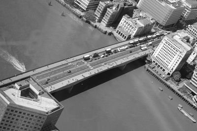 High angle view of bridge over river by buildings