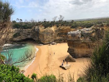 Panoramic view of rocks on shore against sky