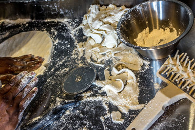 Cropped hands preparing dough