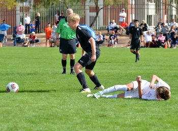 Group of people on soccer field