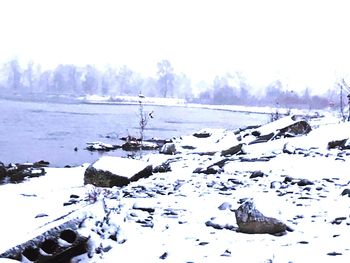 Scenic view of snow covered landscape against sky