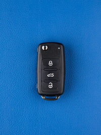 Close-up of usb stick against blue background