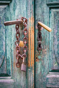 Close-up of padlock on wooden door