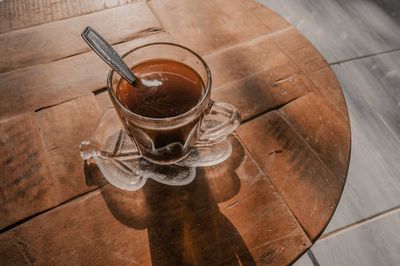 High angle view of coffee cup on floor