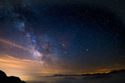 Scenic view of star field against sky at night