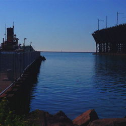 Pier on sea at sunset