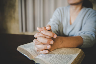 Man hands pray on bible. concept of hope, faith, christianity,  religion, church online.