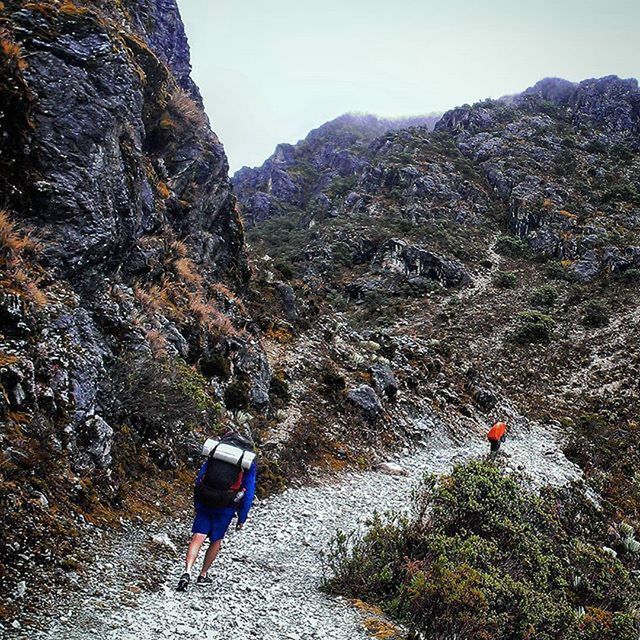 lifestyles, leisure activity, mountain, rear view, men, full length, rock - object, person, tranquility, hiking, nature, tree, tranquil scene, scenics, beauty in nature, rock formation, walking, adventure