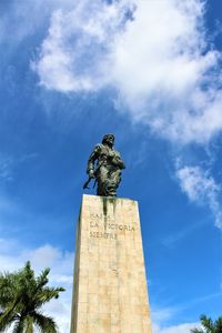 Low angle view of statue against sky