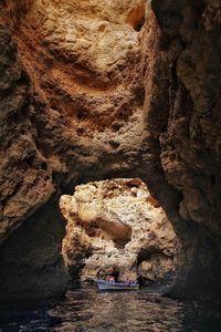 View of cave in river