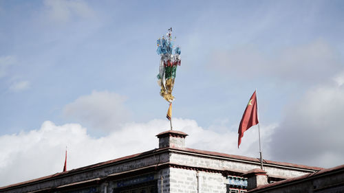 Low angle view of statue against cloudy sky