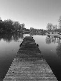 Pier over lake against sky