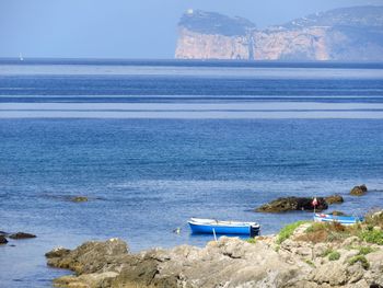 Scenic view of sea against clear blue sky