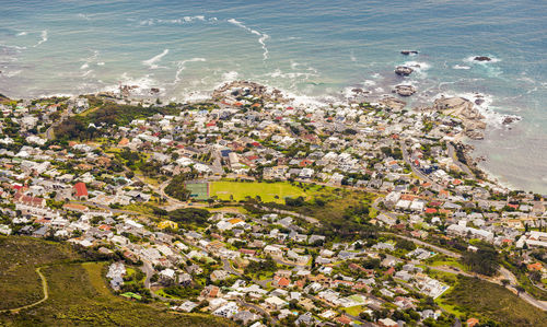 High angle view of buildings and sea in town