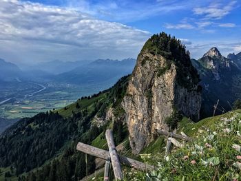 Scenic view of tree mountains against sky