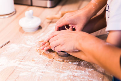 Midsection of woman preparing food on table