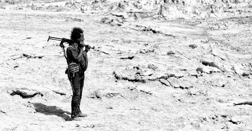 Full length of woman walking on beach