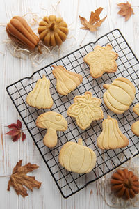 Autumn baking. cookies in the form of pumpkin and leaves on the table. cozy autumn concept.