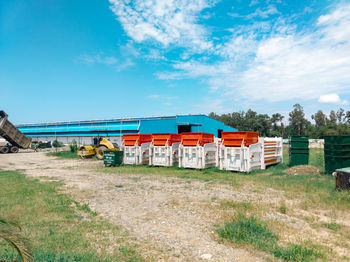 Built structure on field against sky