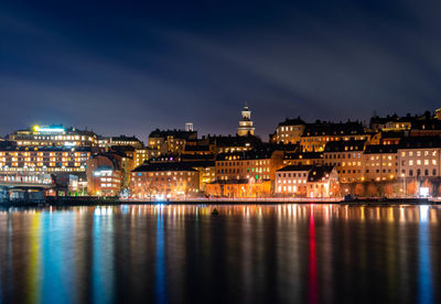 Illuminated buildings in city at night