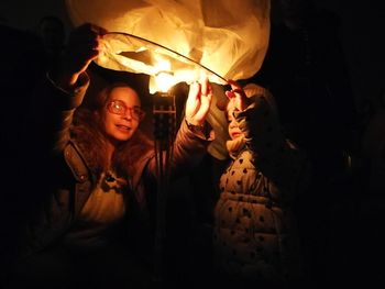 Close-up of girl with illuminated lights