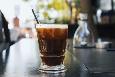 Close-up of coffee in glass on table