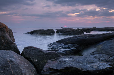 Scenic view of sea against sky at sunset