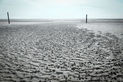 View of sand at beach against sky