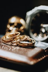 Close-up of wedding rings on table