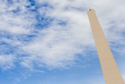 Low angle view of smoke stack against sky