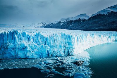 Scenic view of frozen lake against sky