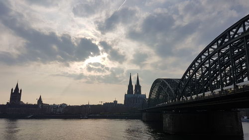 Bridge over river with buildings in background