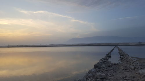 Scenic view of lake against sky during sunset