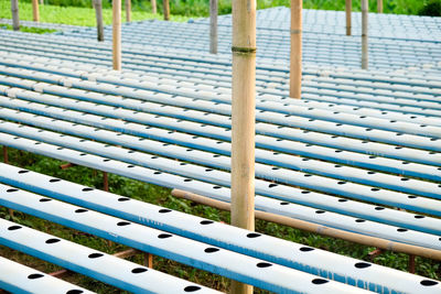 High angle view of metal fence on grass