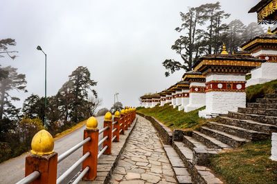 Street amidst buildings against sky