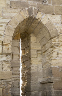 Low angle view of stone wall